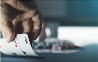 a black boy with headphone writting on a paper